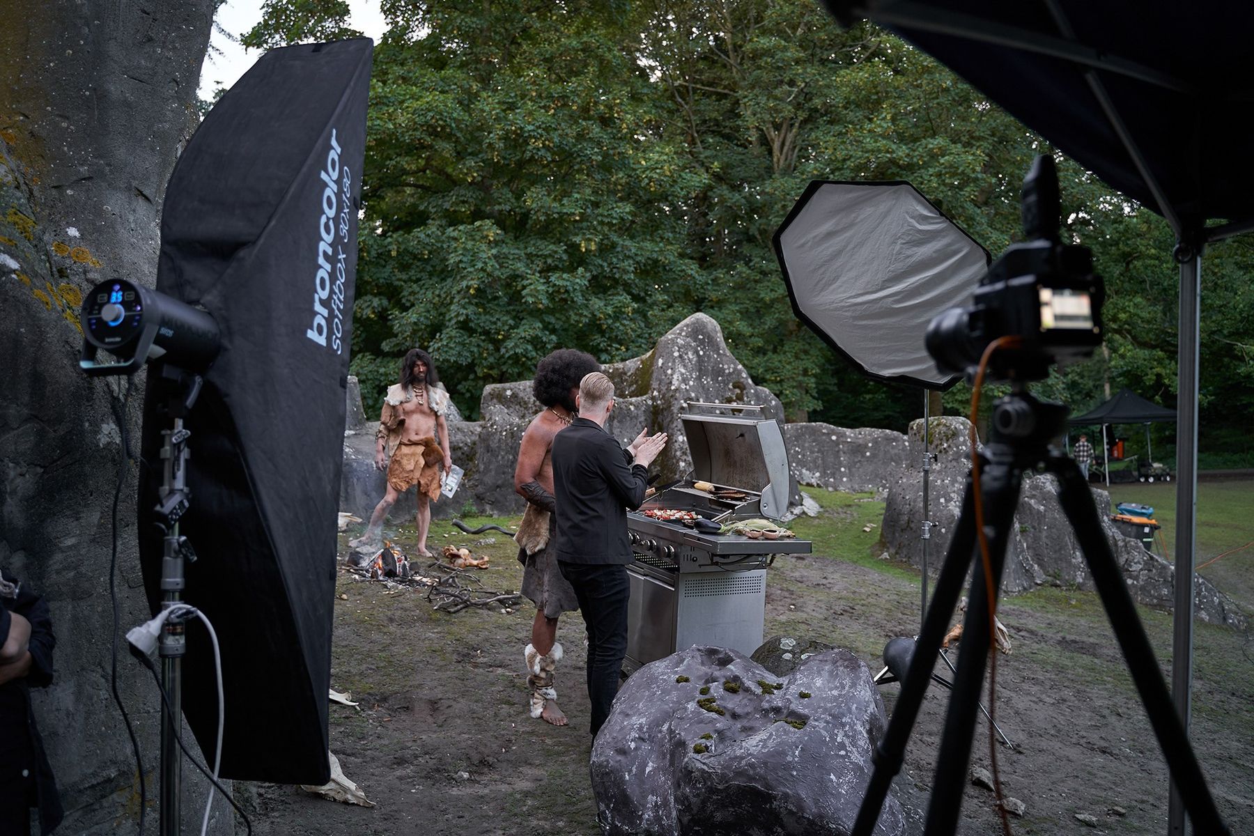 Strip softbox and octabox lighting a stone-age barbecue scene